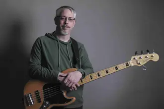 Charlie Pittman holding a bass