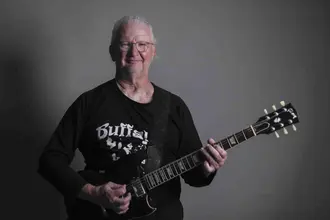 Gary Harmon playing a guitar