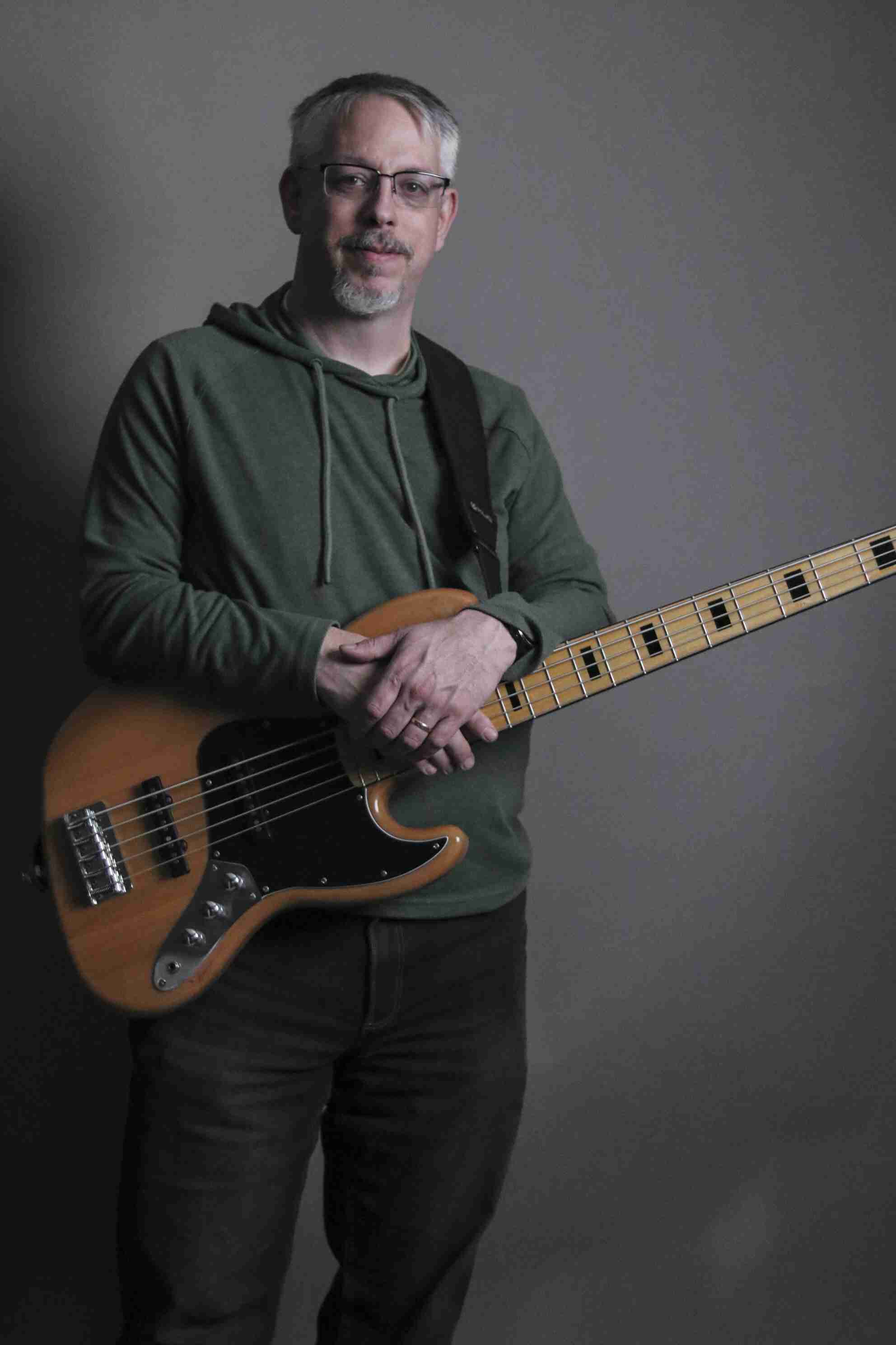 Charlie Pittman holding a bass