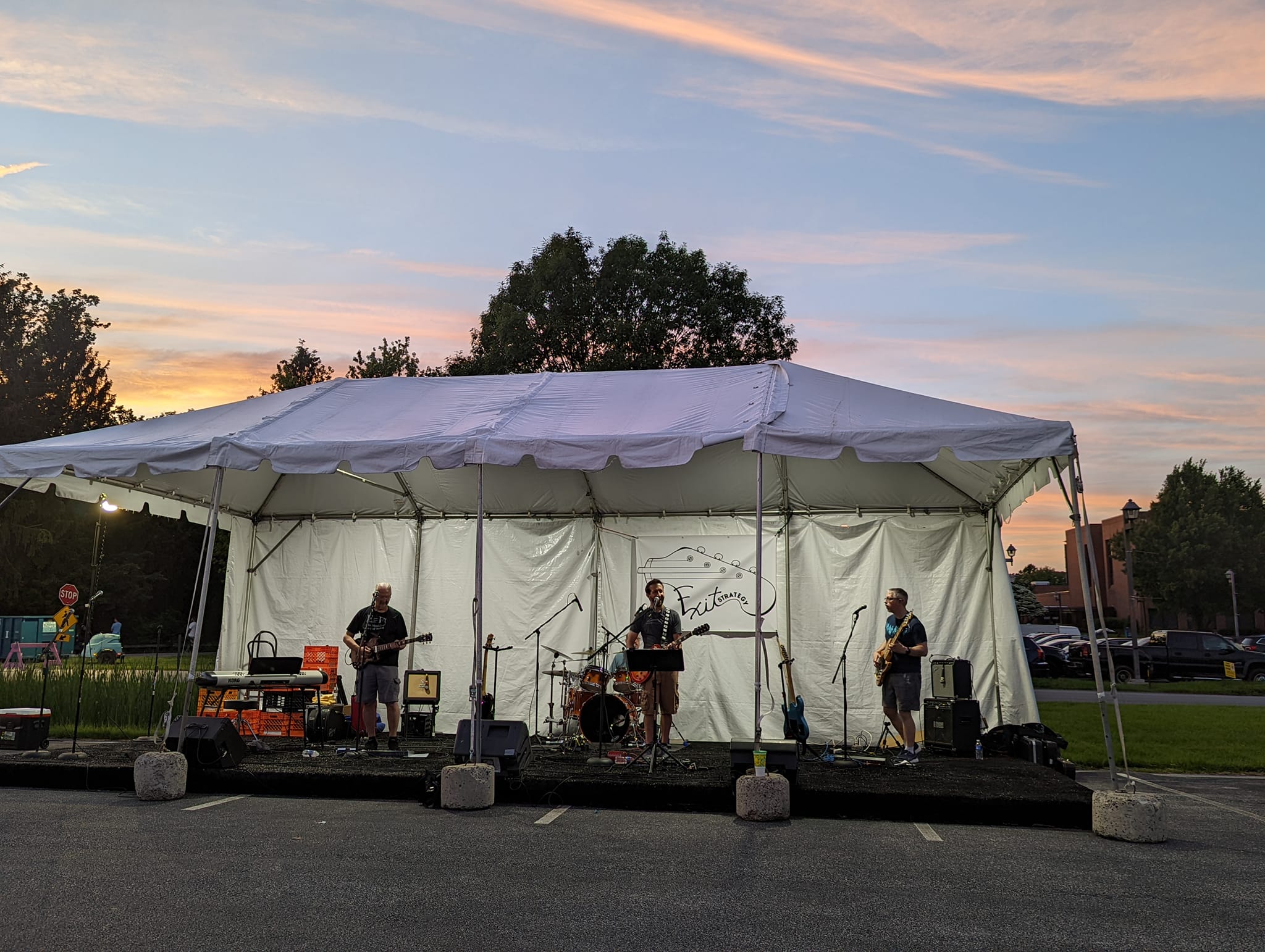 Exit Strategy playing in pavillion at sunset