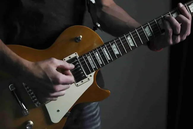 Close-up of an electric guitar being played