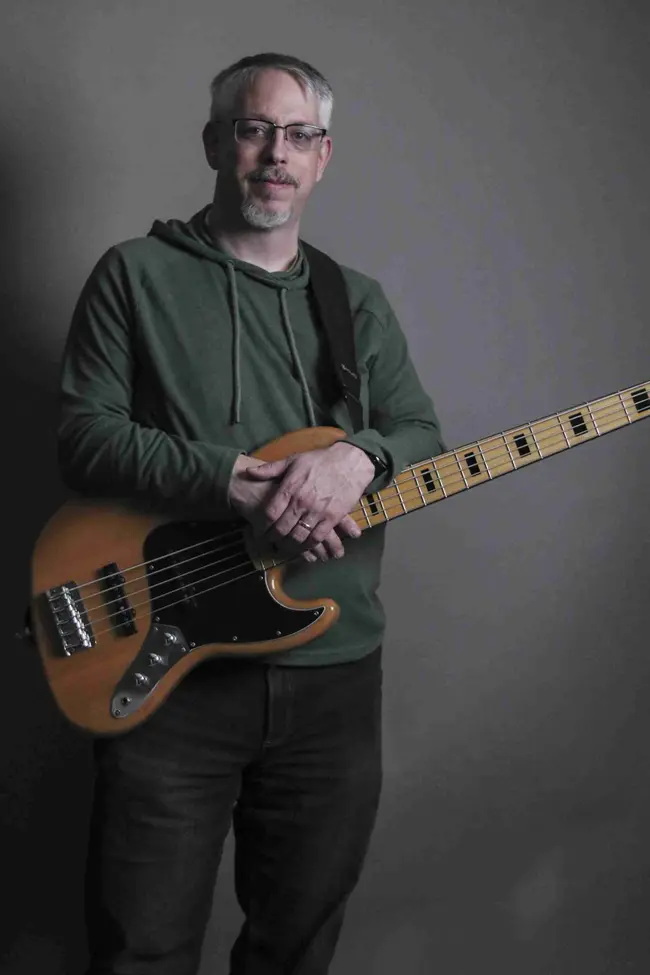 Charlie Pittman holding a bass