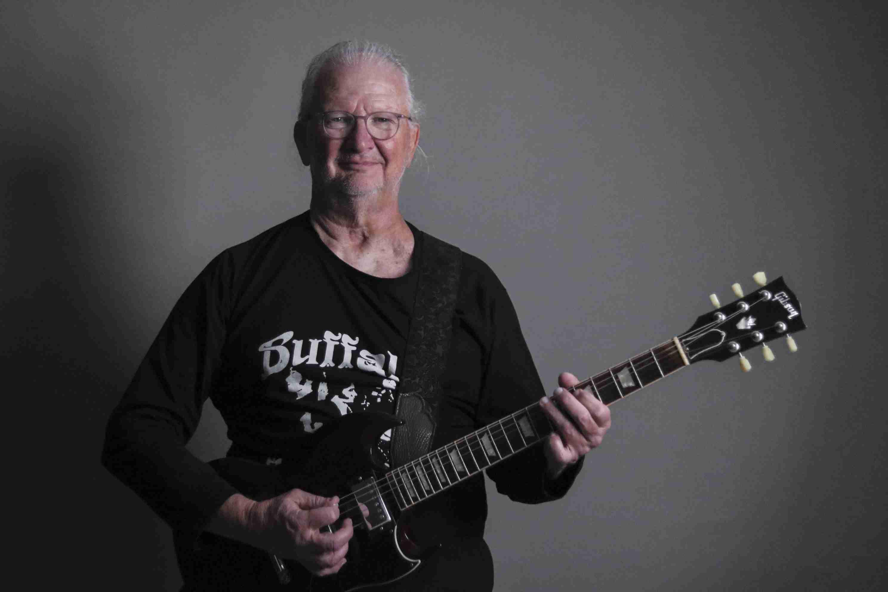 Gary Harmon playing a guitar